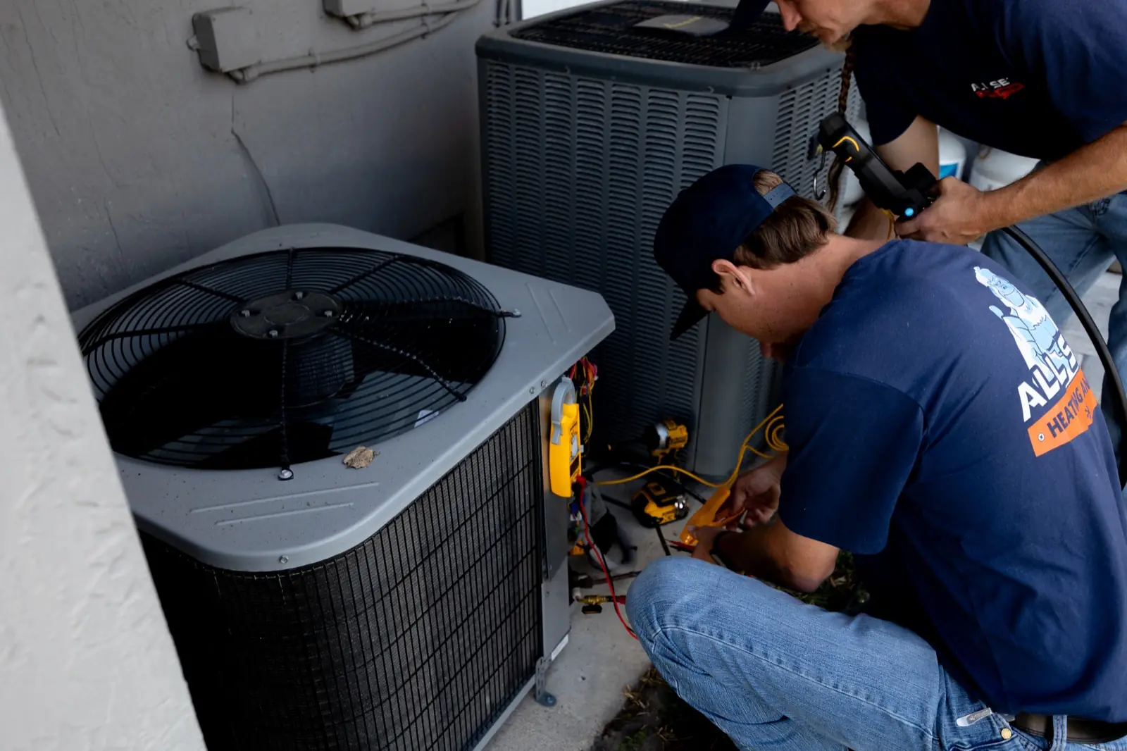 All Set technician servicing an outdoor AC unit